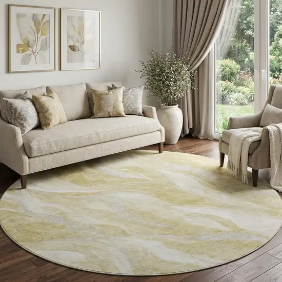 8' Gold And Ivory Abstract Washable Round Rug With UV Protection Photo 1