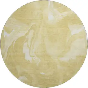 Photo of 8' Gold And Ivory Abstract Washable Round Rug With UV Protection