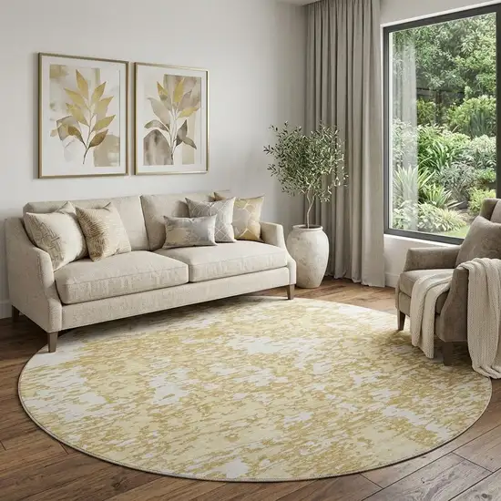 8' Gold And Ivory Abstract Washable Round Rug With UV Protection Photo 1