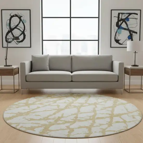 8' Gold And Ivory Abstract Washable Round Rug With UV Protection Photo 2