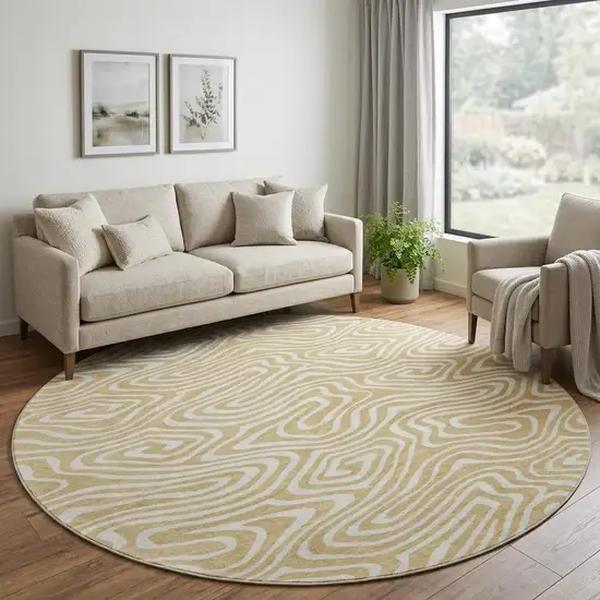8' Gold And Ivory Abstract Washable Round Rug With UV Protection Photo 1