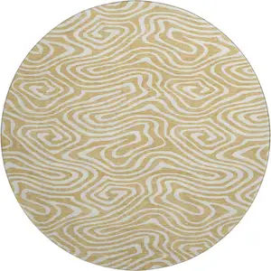 Photo of 8' Gold And Ivory Abstract Washable Round Rug With UV Protection