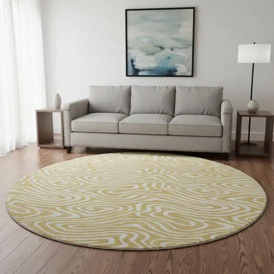8' Gold And Ivory Abstract Washable Round Rug With UV Protection Photo 2
