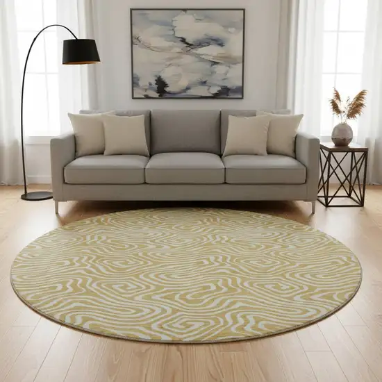 8' Gold And Ivory Abstract Washable Round Rug With UV Protection Photo 2
