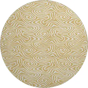 Photo of 8' Gold And Ivory Abstract Washable Round Rug With UV Protection