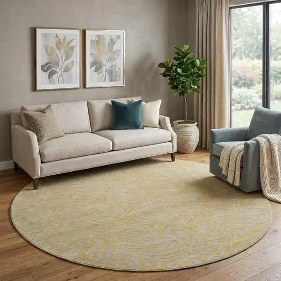 8' Gold And Ivory Abstract Washable Round Rug With UV Protection Photo 1