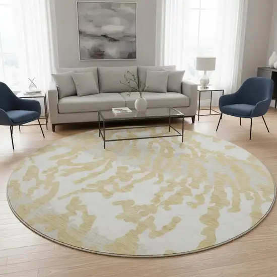 8' Gold And Ivory Animal Print Washable Round Rug With UV Protection Photo 2