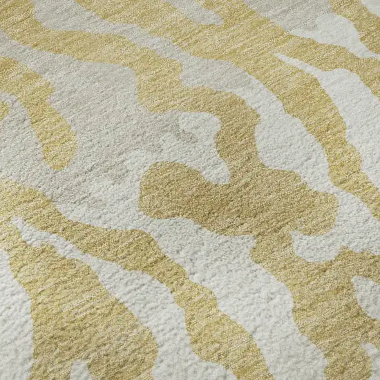 8' Gold And Ivory Animal Print Washable Round Rug With UV Protection Photo 9