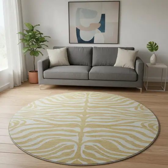 8' Gold And Ivory Animal Print Washable Round Rug With UV Protection Photo 1