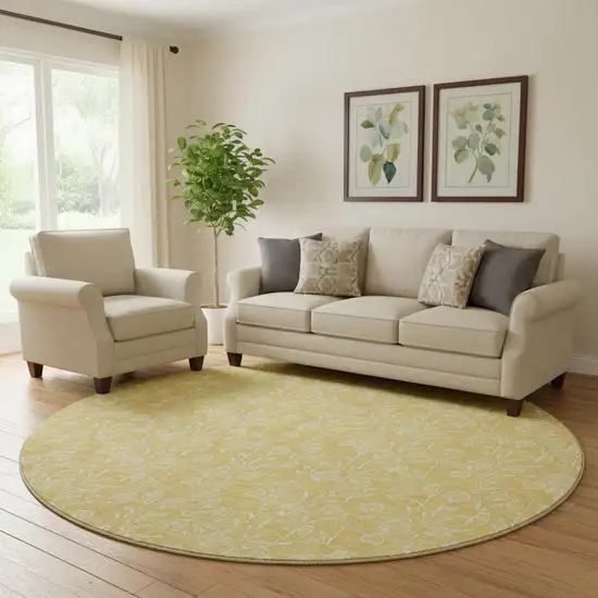 8' Gold And Ivory Floral Washable Round Rug With UV Protection Photo 1