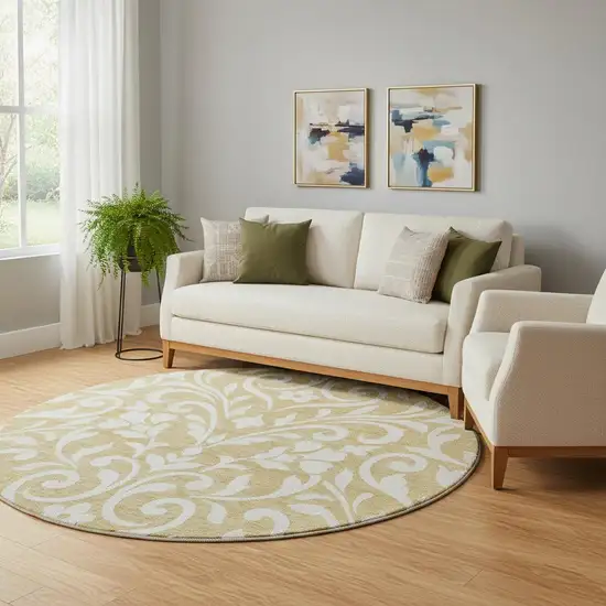 8' Gold And Ivory Floral Washable Round Rug With UV Protection Photo 1
