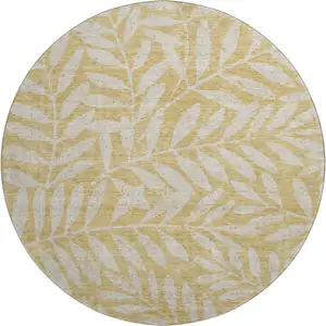 Photo of 8' Gold And Ivory Floral Washable Round Rug With UV Protection