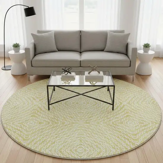 8' Gold And Ivory Geometric Washable Round Rug With UV Protection Photo 1