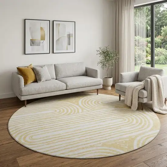 8' Gold And Ivory Geometric Distressed Washable Round Rug With UV Protection Photo 1