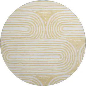 Photo of 8' Gold And Ivory Geometric Washable Round Rug With UV Protection