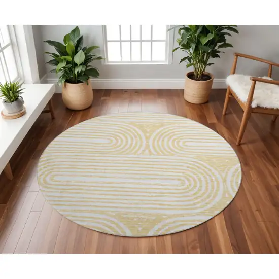 8' Gold And Ivory Geometric Washable Round Rug With UV Protection Photo 2