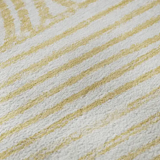 8' Gold And Ivory Geometric Distressed Washable Round Rug With UV Protection Photo 9