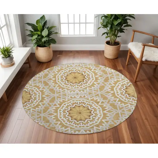 8' Gold And Ivory Geometric Washable Round Rug With UV Protection Photo 2