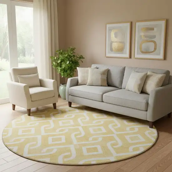 8' Gold And Ivory Geometric Washable Round Rug With UV Protection Photo 1