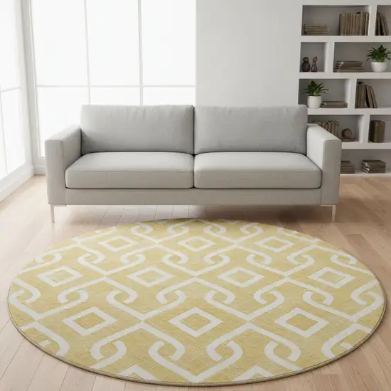 8' Gold And Ivory Geometric Washable Round Rug With UV Protection Photo 2
