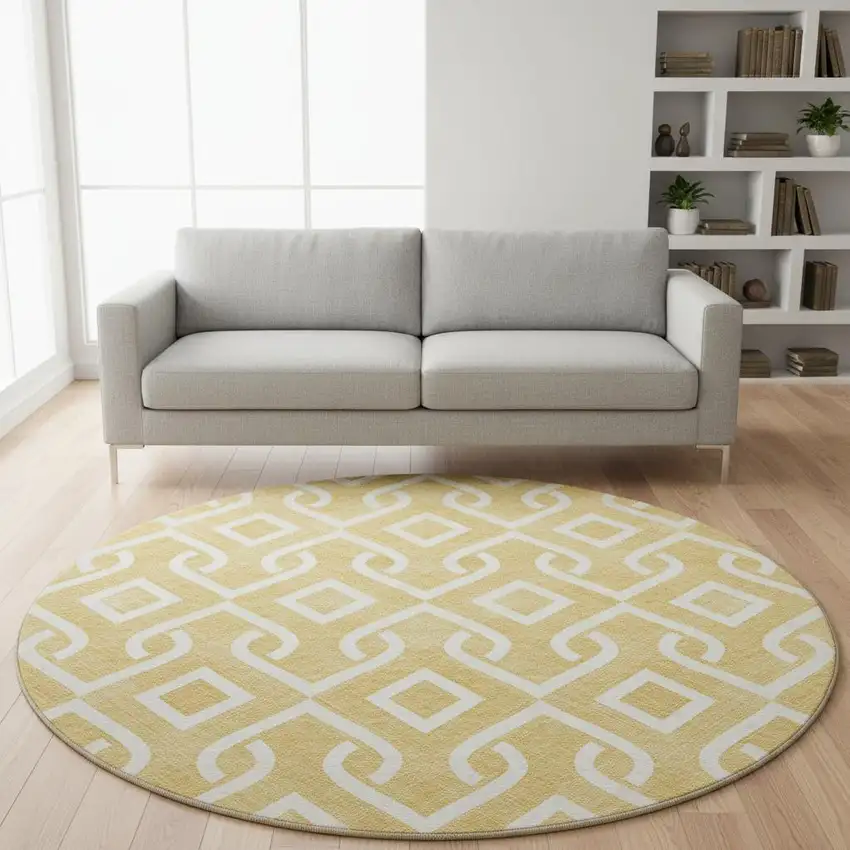 8' Gold And Ivory Geometric Washable Round Rug With UV Protection Photo 2
