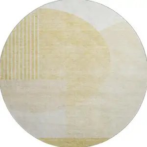Photo of 8' Gold And Ivory Geometric Washable Round Rug With UV Protection