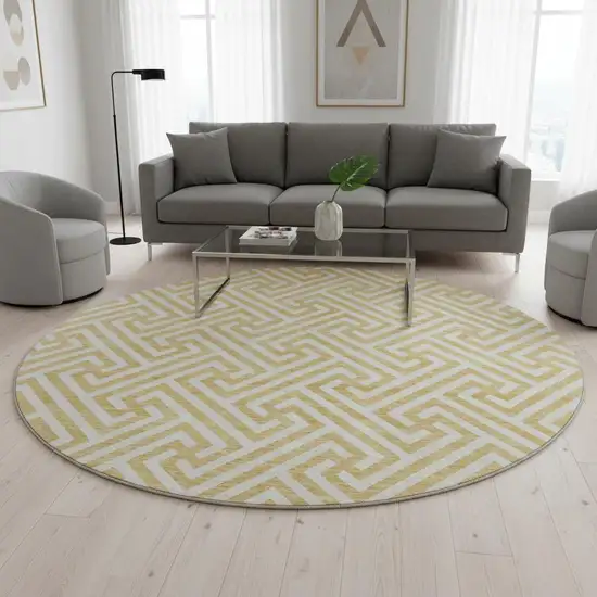 8' Gold And Ivory Geometric Washable Round Rug With UV Protection Photo 2