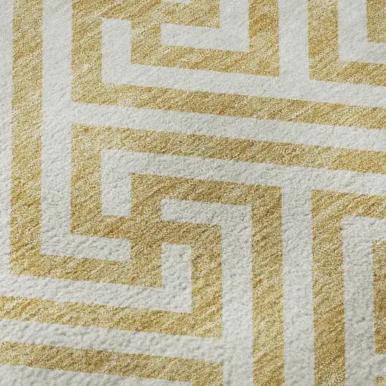 8' Gold And Ivory Geometric Washable Round Rug With UV Protection Photo 9