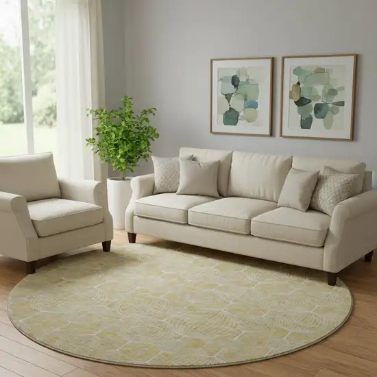8' Gold And Ivory Geometric Washable Round Rug With UV Protection Photo 1
