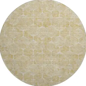 Photo of 8' Gold And Ivory Geometric Washable Round Rug With UV Protection
