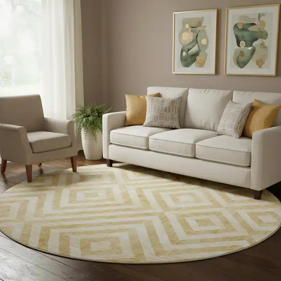 8' Gold And Ivory Geometric Washable Round Rug With UV Protection Photo 1
