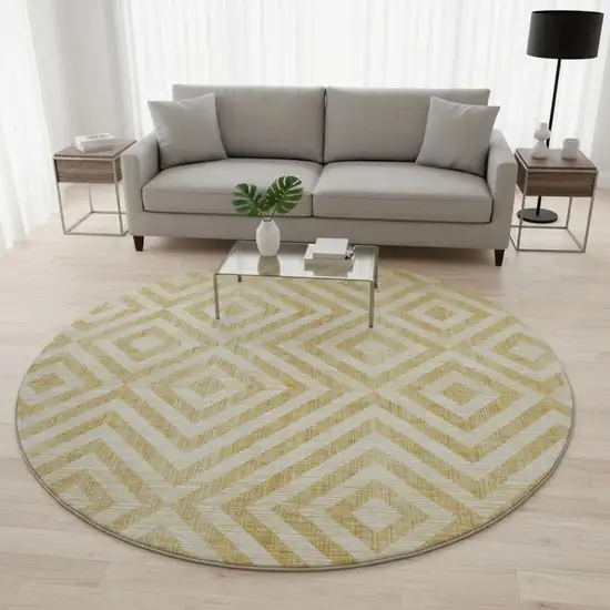 8' Gold And Ivory Geometric Washable Round Rug With UV Protection Photo 2