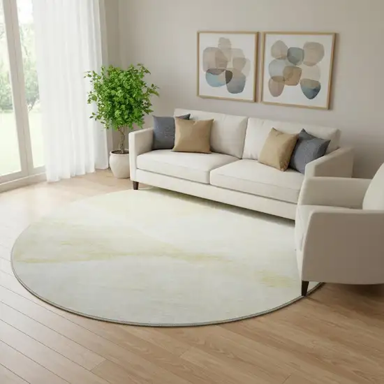 8' Gold And Ivory Geometric Washable Round Rug With UV Protection Photo 1