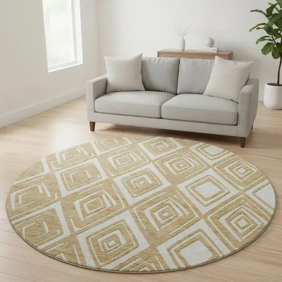 8' Gold And Ivory Geometric Washable Round Rug With UV Protection Photo 2