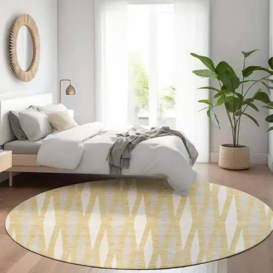 8' Gold And Ivory Geometric Washable Round Rug With UV Protection Photo 5