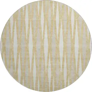 Photo of 8' Gold And Ivory Geometric Washable Round Rug With UV Protection