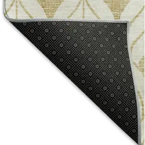 Photo of 8' Gold And Ivory Geometric Washable Round Rug With UV Protection
