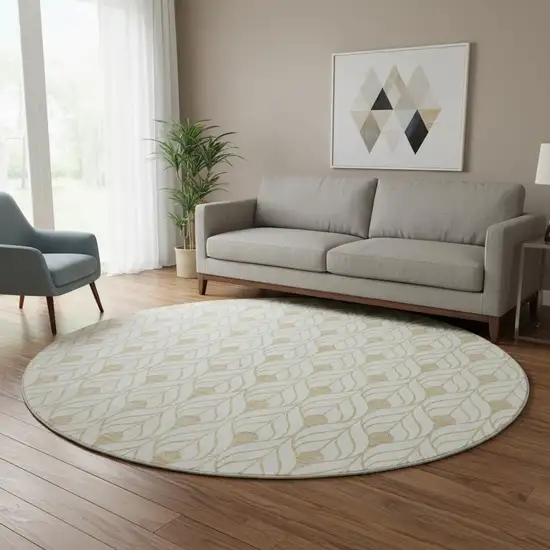 8' Gold And Ivory Geometric Washable Round Rug With UV Protection Photo 2