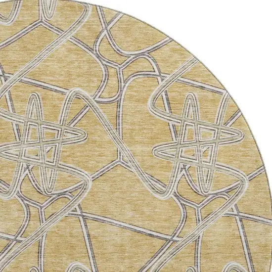 8' Gold And Ivory Geometric Washable Round Rug With UV Protection Photo 3