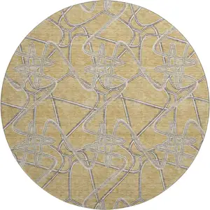 Photo of 8' Gold And Ivory Geometric Washable Round Rug With UV Protection