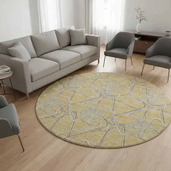 8' Gold And Ivory Geometric Washable Round Rug With UV Protection Photo 2