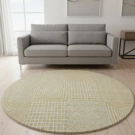 8' Gold And Ivory Geometric Washable Round Rug With UV Protection Photo 2