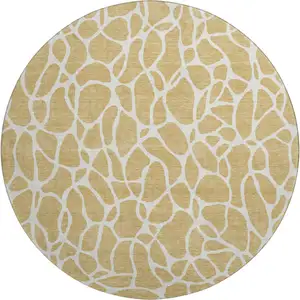 Photo of 8' Gold And Ivory Geometric Washable Round Rug With UV Protection