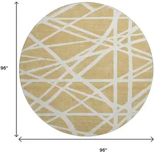 Photo of 8' Gold And Ivory Geometric Washable Round Rug With UV Protection