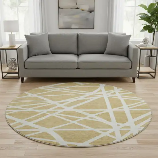 8' Gold And Ivory Geometric Washable Round Rug With UV Protection Photo 2