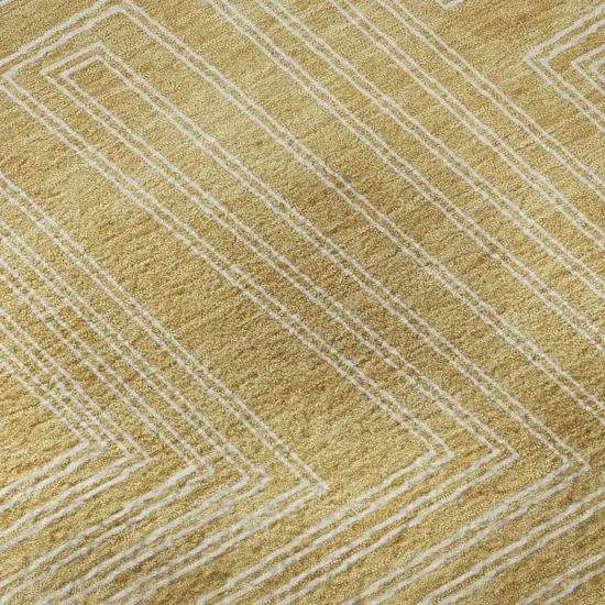 8' Gold And Ivory Geometric Washable Round Rug With UV Protection Photo 7