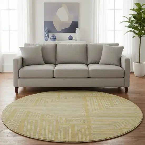 8' Gold And Ivory Geometric Washable Round Rug With UV Protection Photo 2