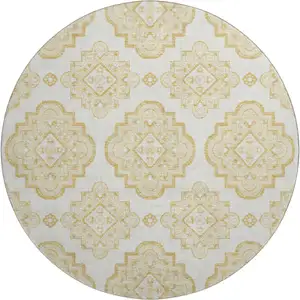 Photo of 8' Gold And Ivory Medallion Washable Round Rug With UV Protection
