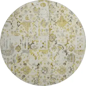 Photo of 8' Gold And Ivory Patchwork Washable Round Rug With UV Protection