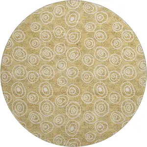 Photo of 8' Gold And Ivory Polka Dot Washable Round Rug With UV Protection